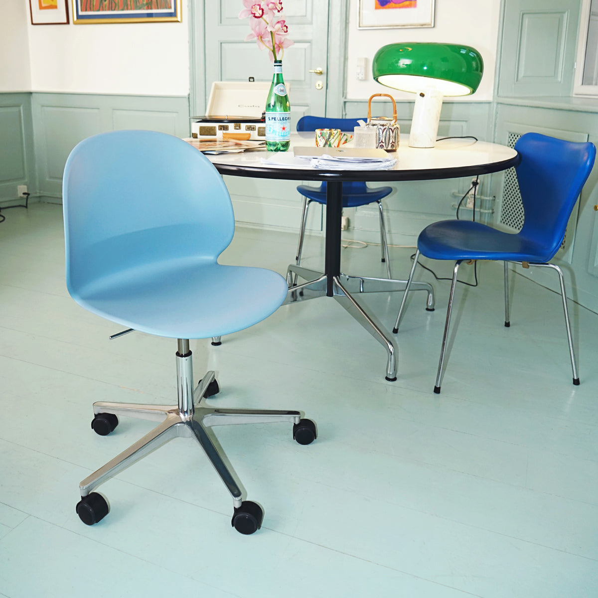 N02 Recycle Swivel Chair by Fritz Hansen, showing n02 recycle swivel chair in live shot.