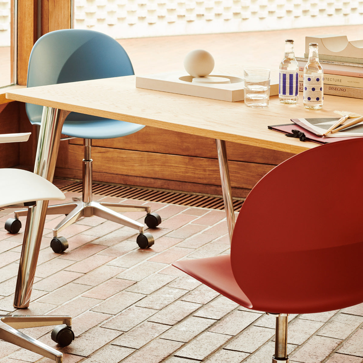 N02 Recycle Swivel Chair by Fritz Hansen, showing n02 recycle swivel chairs in live shot.
