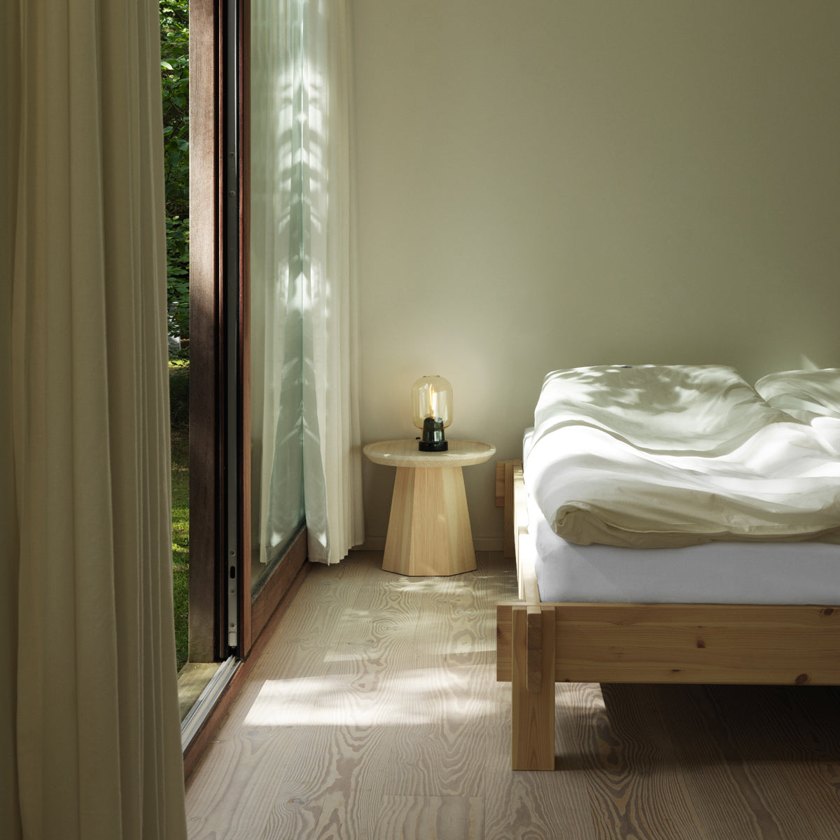 Notch Bed Frame by Normann Copenhagen, showing closeup view of notch bed frame in live shot.