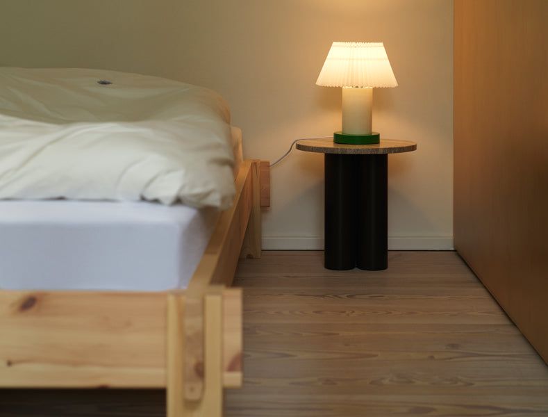 Notch Bed Frame by Normann Copenhagen, showing closeup view of notch bed frame in live shot.