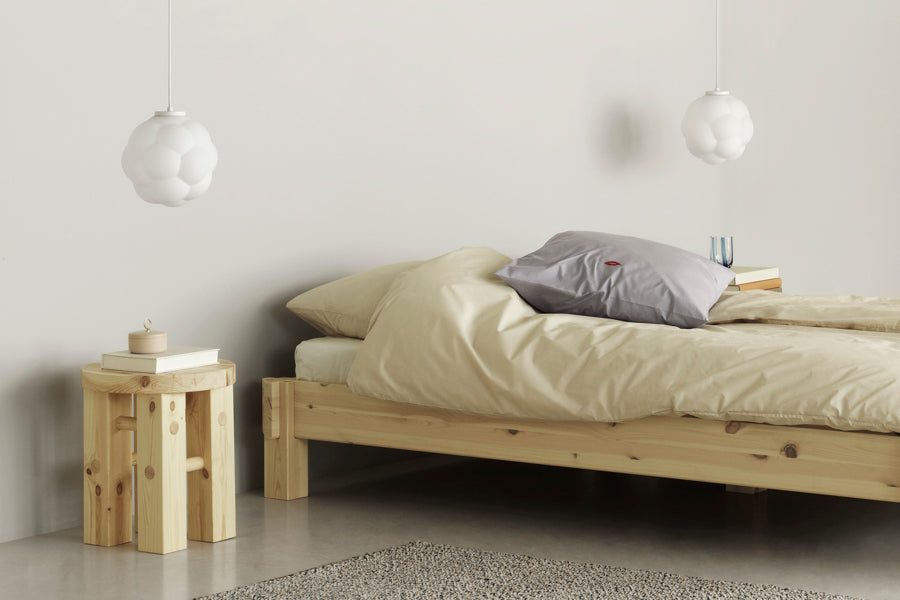 Notch Bed Frame by Normann Copenhagen, showing closeup view of notch bed frame in live shot.