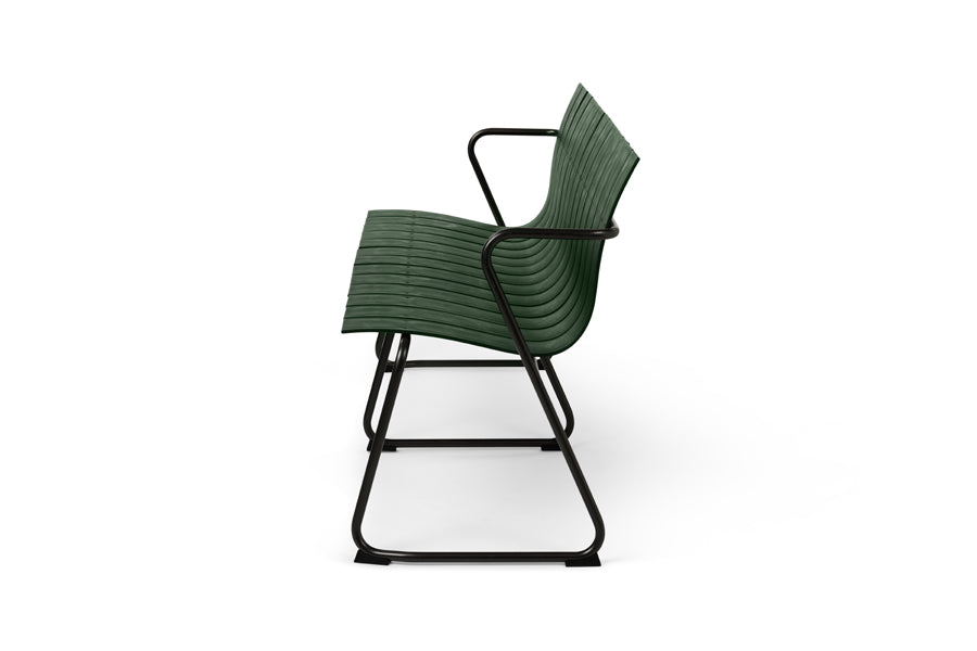 Ocean Bench by Mater, showing side view of ocean bench in green plastic seat.