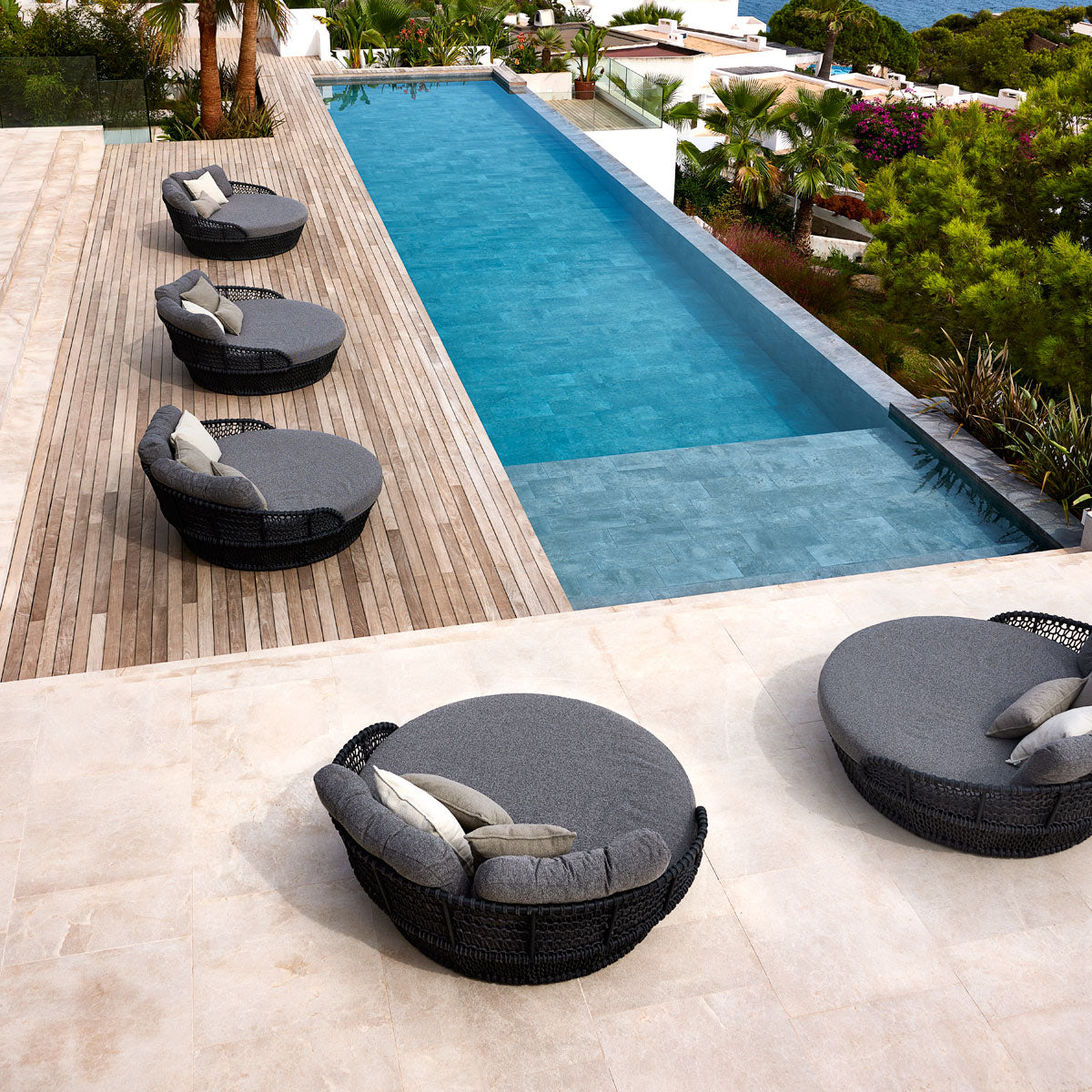 Ocean Daybed by Cane-Line, showing ocean daybeds in live shot.