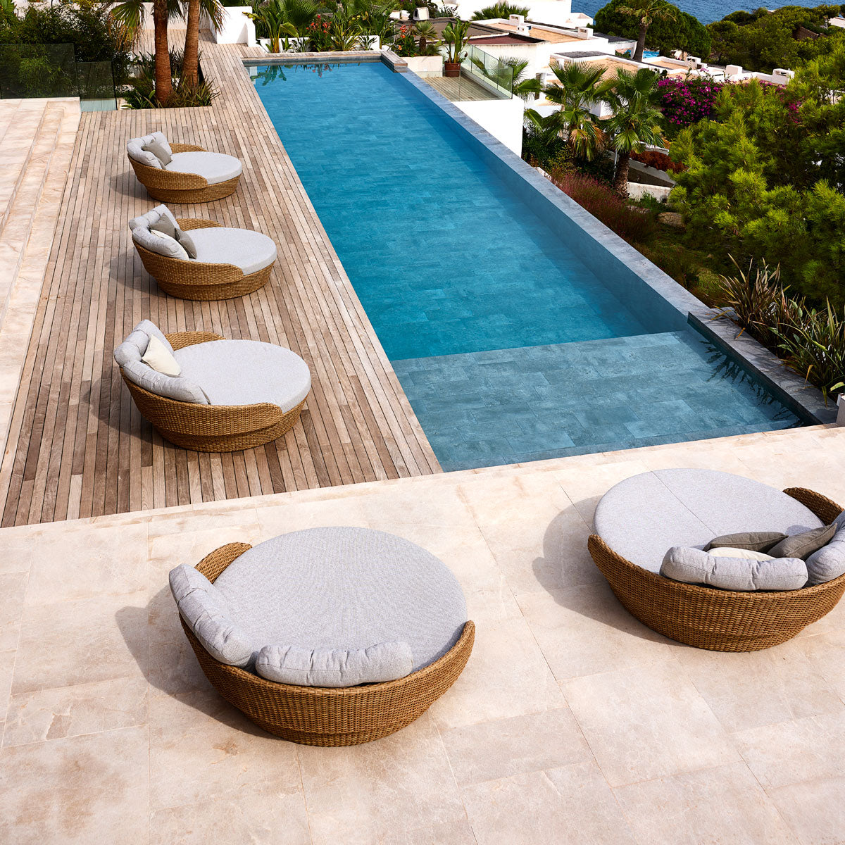 Ocean Daybed by Cane-Line, showing ocean daybeds in live shot.