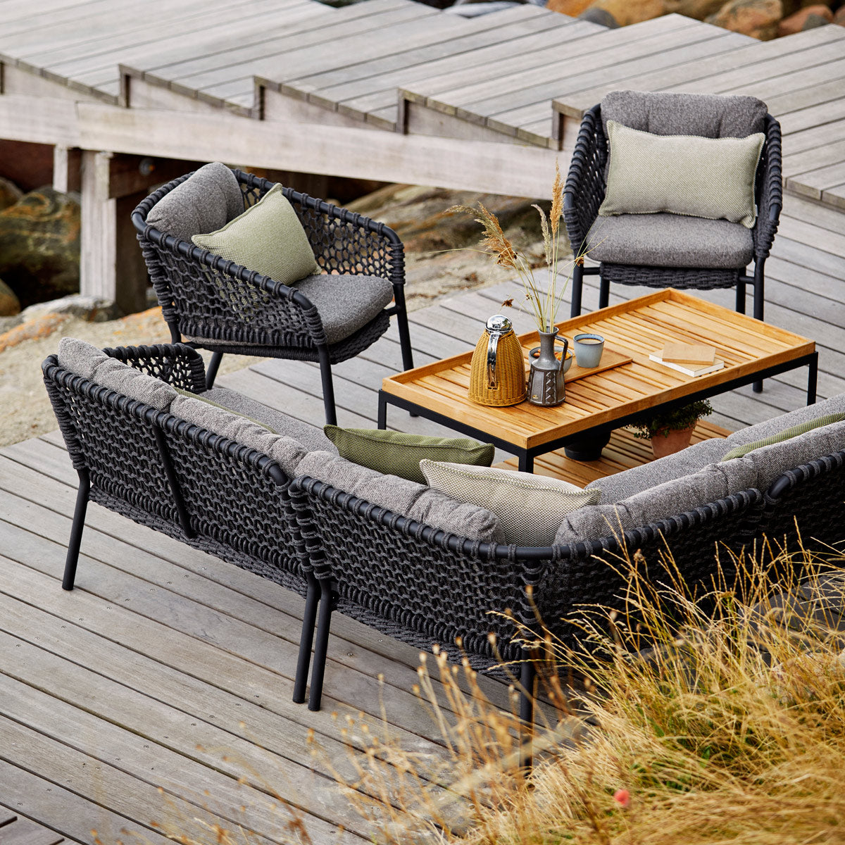 Ocean Large Lounge Chair by Cane-Line, showing ocean large lounge chairs in live shot.
