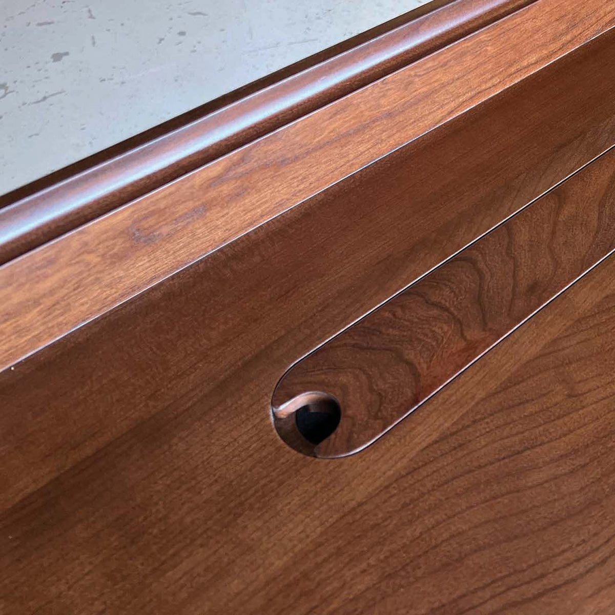 Odin Sit-Stand Desk by Copeland Furniture, showing closeup view of odin sit-stand desk in live shot.