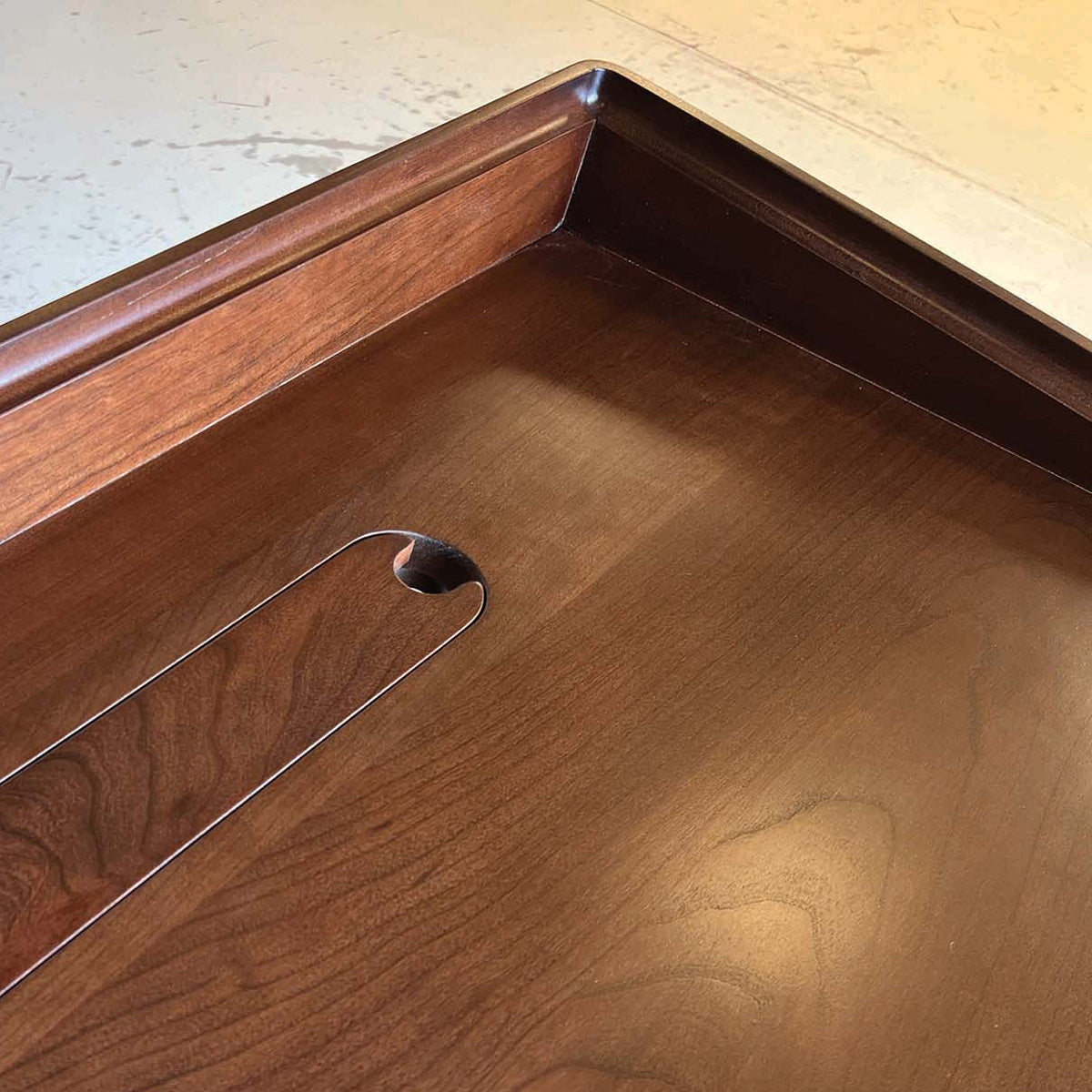 Odin Sit-Stand Desk by Copeland Furniture, showing closeup view of odin sit-stand desk in live shot.