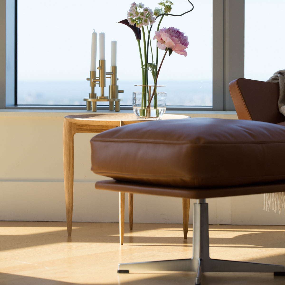 Oksen Footstool by Fritz Hansen, showing closeup view of oksen footstool in live shot.