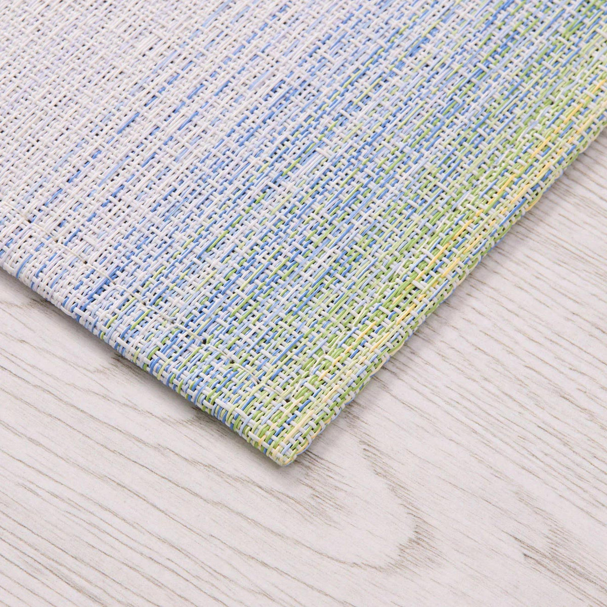 Ombre Woven Floor Mat by Chilewich, showing closeup view of ombre woven floor mat in live shot.