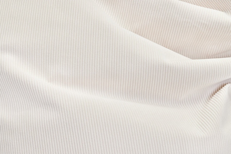 Original Slim Recycled Cord Bean Bag by Fatboy, showing closeup view of original slim recycled cord bean bag in cream fabric.