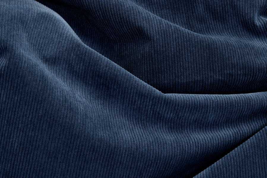 Original Slim Recycled Cord Bean Bag by Fatboy, showing closeup view of original slim recycled cord bean bag in deep blue fabric.