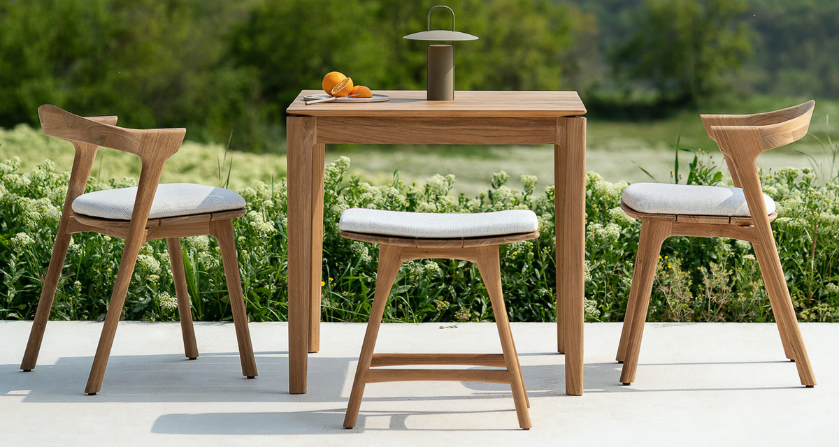 Osso Outdoor Stool by Ethnicraft, showing osso outdoor stool in live shot.
