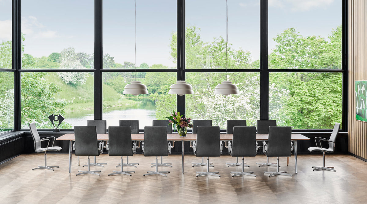 Oxford 4-Star Base Armchair by Fritz Hansen, showing oxford 4-star base armchairs in live shot.