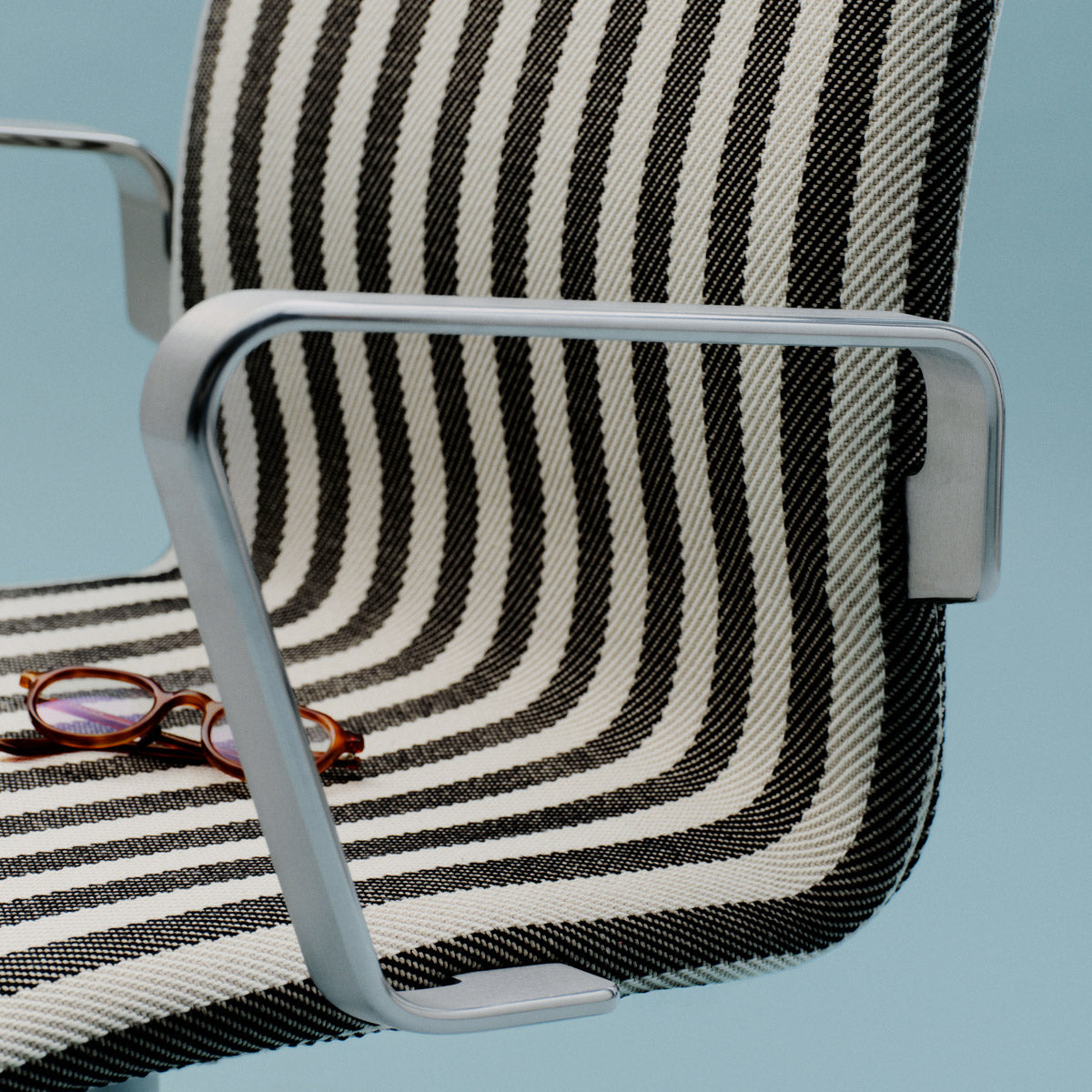 Oxford 4-Star Base Armchair by Fritz Hansen, showing closeup view of oxford 4-star base armchair in live shot.