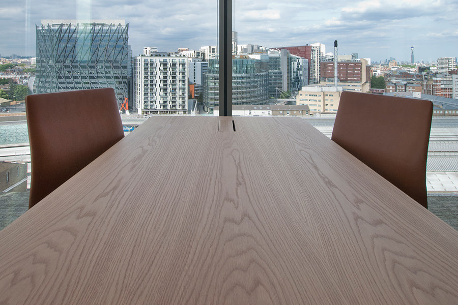 Oxford 4-Star Base Armchair by Fritz Hansen, showing oxford 4-star base armchairs in live shot.