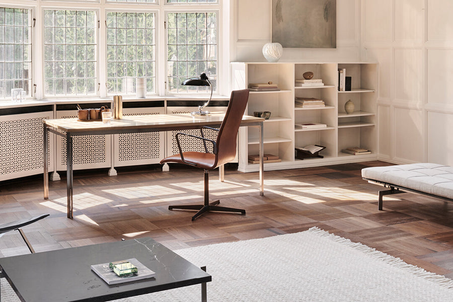 Oxford 4-Star Base Armchair by Fritz Hansen, showing oxford 4-star base armchair in live shot.
