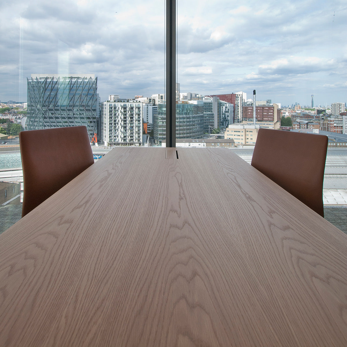 Oxford 4-Star Base Chair by Fritz Hansen, showing closeup view of oxford 4-star base chairs in live shot.