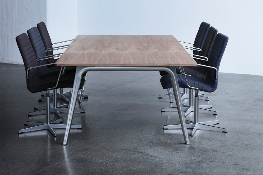 Oxford 5-Star Base Armchair by Fritz Hansen, showing oxford 5-star base armchairs in live shot.