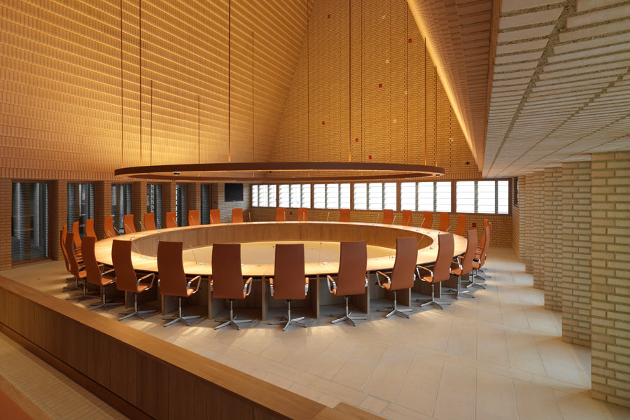 Oxford 5-Star Base Armchair by Fritz Hansen, showing oxford 5-star base armchairs in live shot.