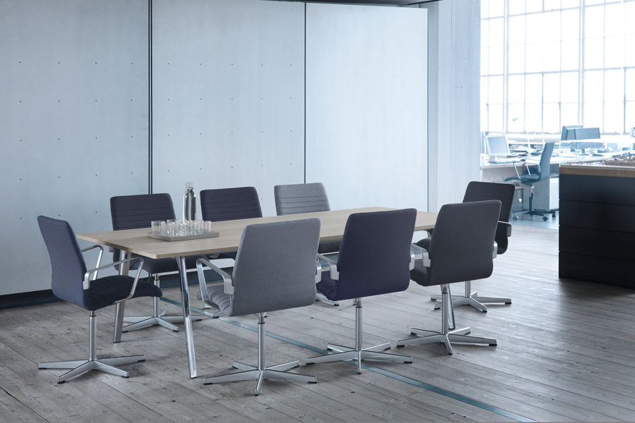 Oxford 5-Star Base Armchair by Fritz Hansen, showing oxford 5-star base armchairs in live shot.