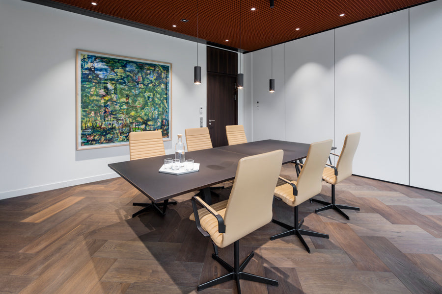 Oxford 5-Star Base Armchair with Castors by Fritz Hansen, showing oxford 5-star base armchairs with castors in live shot.