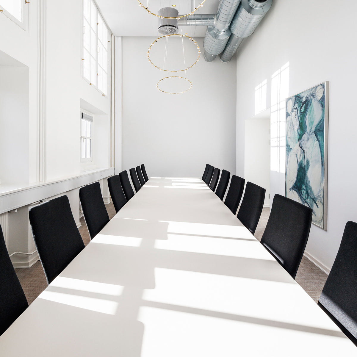 Oxford 5-Star Base Chair by Fritz Hansen, showing oxford 5-star base chairs in live shot.
