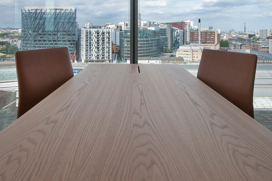 Oxford 5-Star Base Chair by Fritz Hansen, showing closeup view of oxford 5-star base chairs in live shot.
