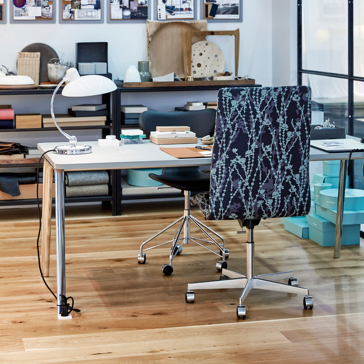 Oxford 5-Star Base Chair with Castors by Fritz Hansen, showing oxford 5-star base chair with castors in live shot.