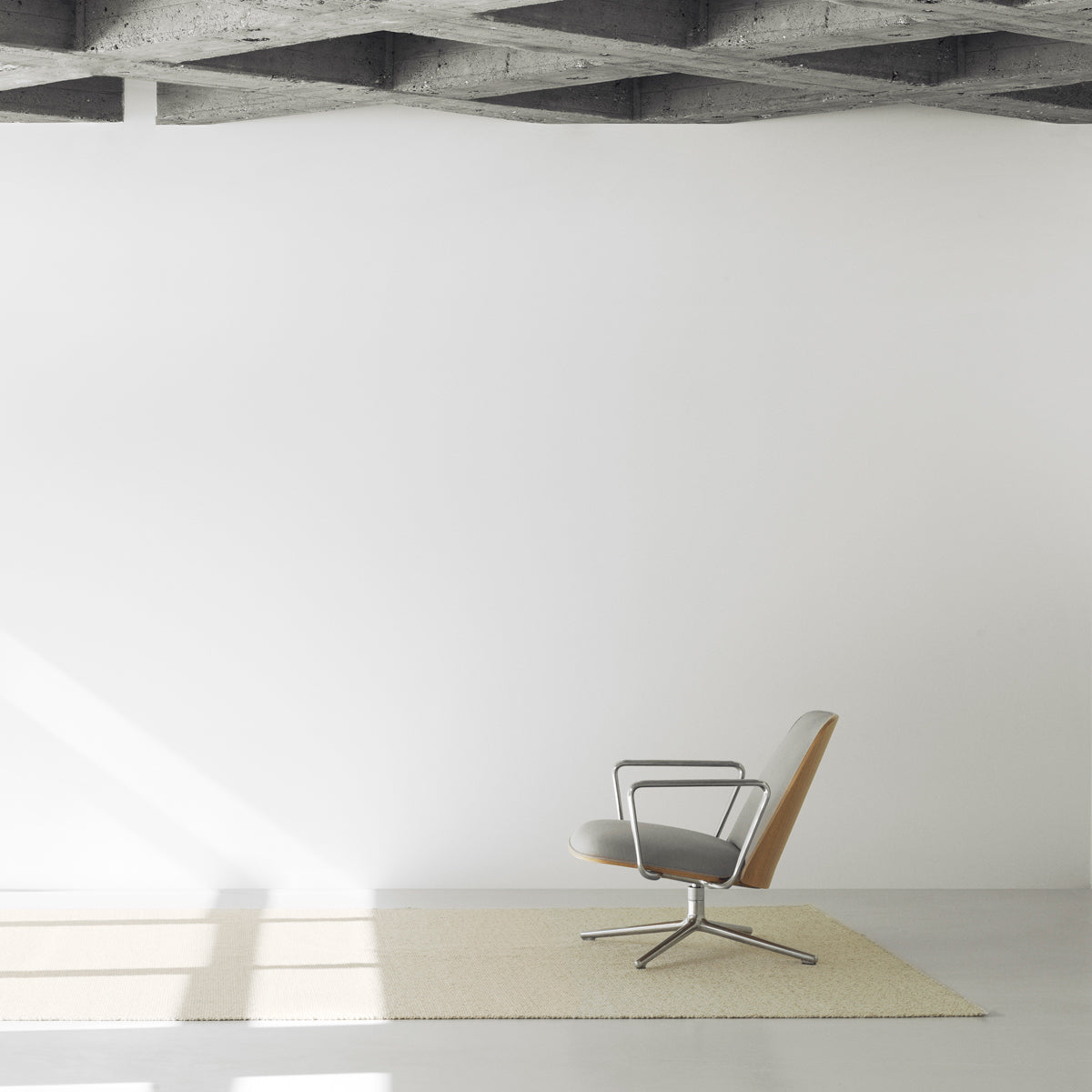Pad Lounge Swivel Chair by Normann Copenhagen, showing pad lounge swivel chair in live shot.
