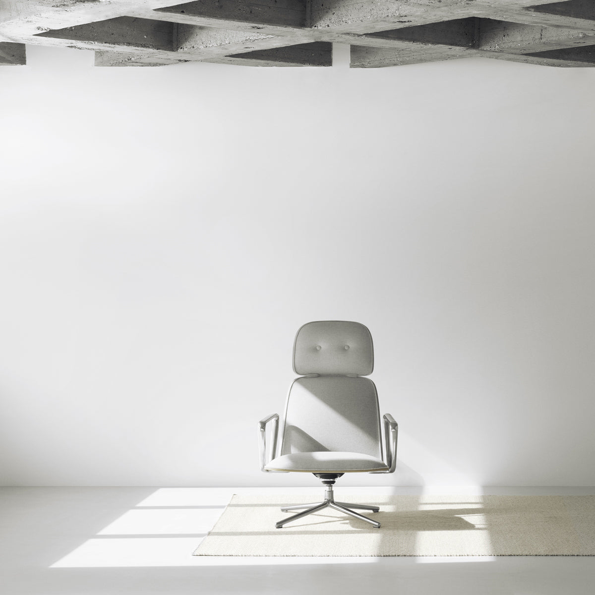 Pad Lounge Tilt Swivel Chair by Normann Copenhagen, showing pad lounge tilt swivel chair in live shot.