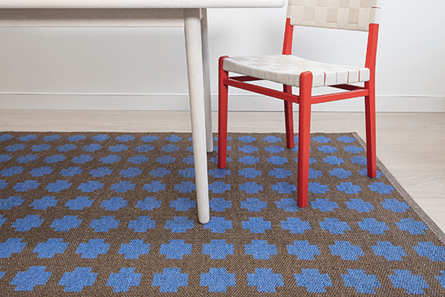 Paloma Woven Plastic Rug by Brita, showing paloma woven plastic rug in live shot.