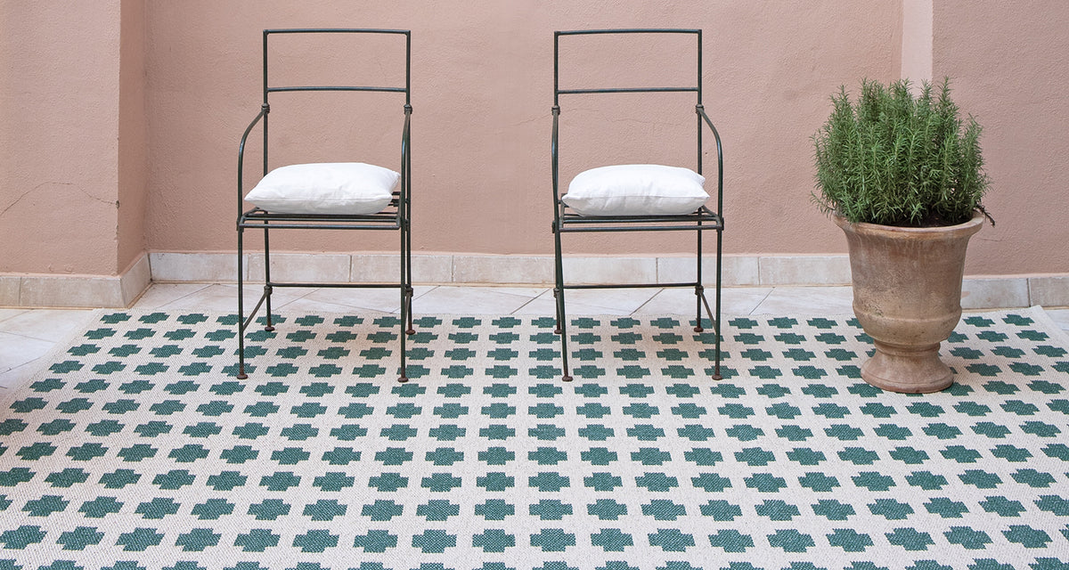 Paloma Woven Plastic Rug by Brita, showing paloma woven plastic rug in live shot.