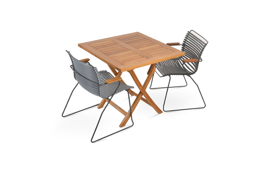 Pamela Folding Dining Table by SohoConcept, showing angle view of pamela folding dining table in square/teak wood with chairs.