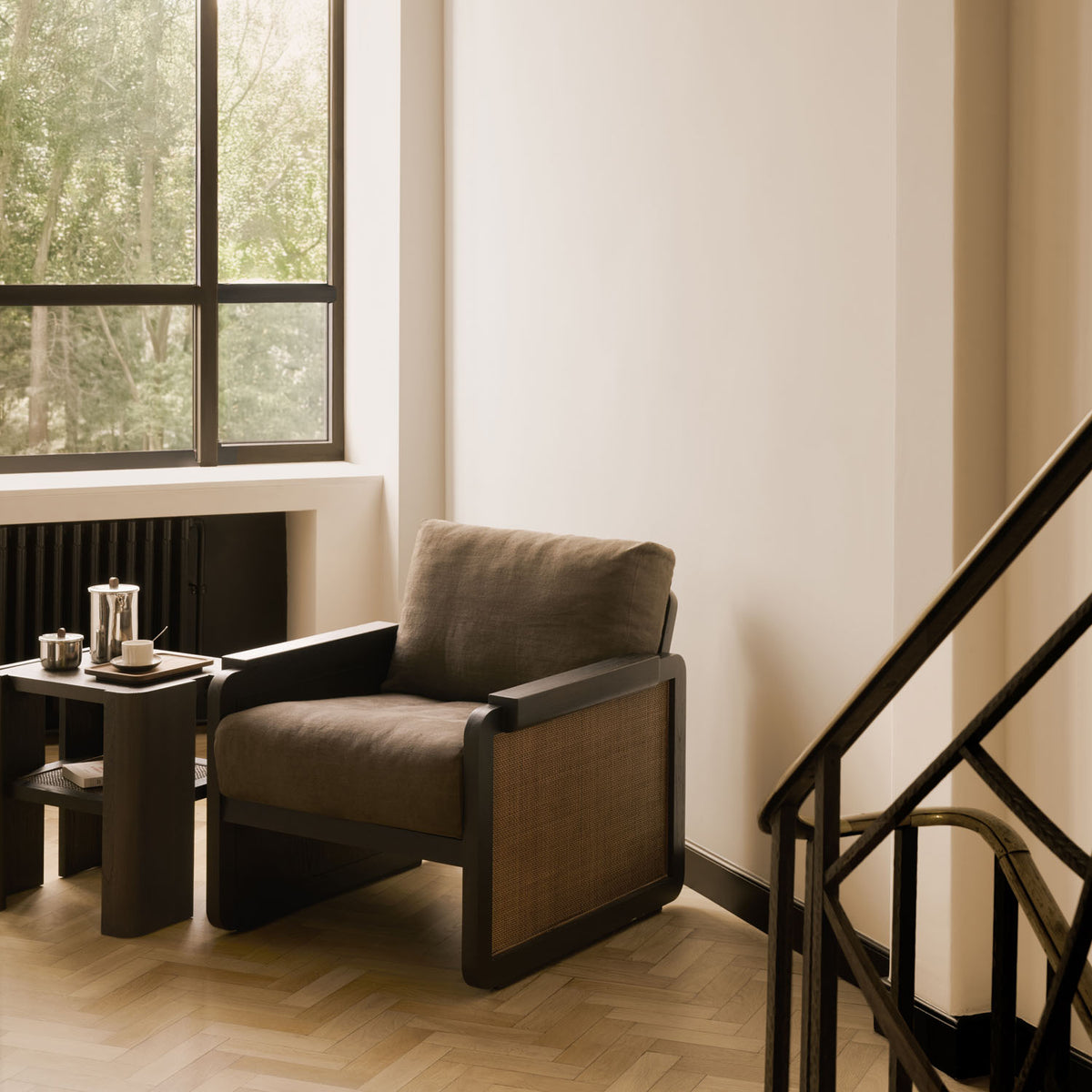 Panel Lounge Chair by Ethnicraft, showing panel lounge chair in live shot.