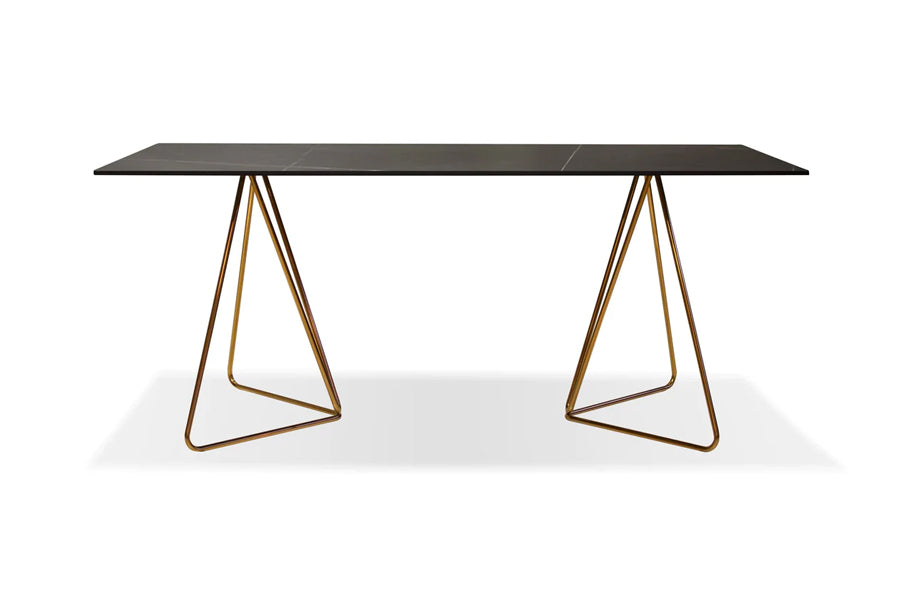 Papillon Dining Table by Mobital, showing front view of papillon dining table in 71"/laurent black top/rose gold steel frame.