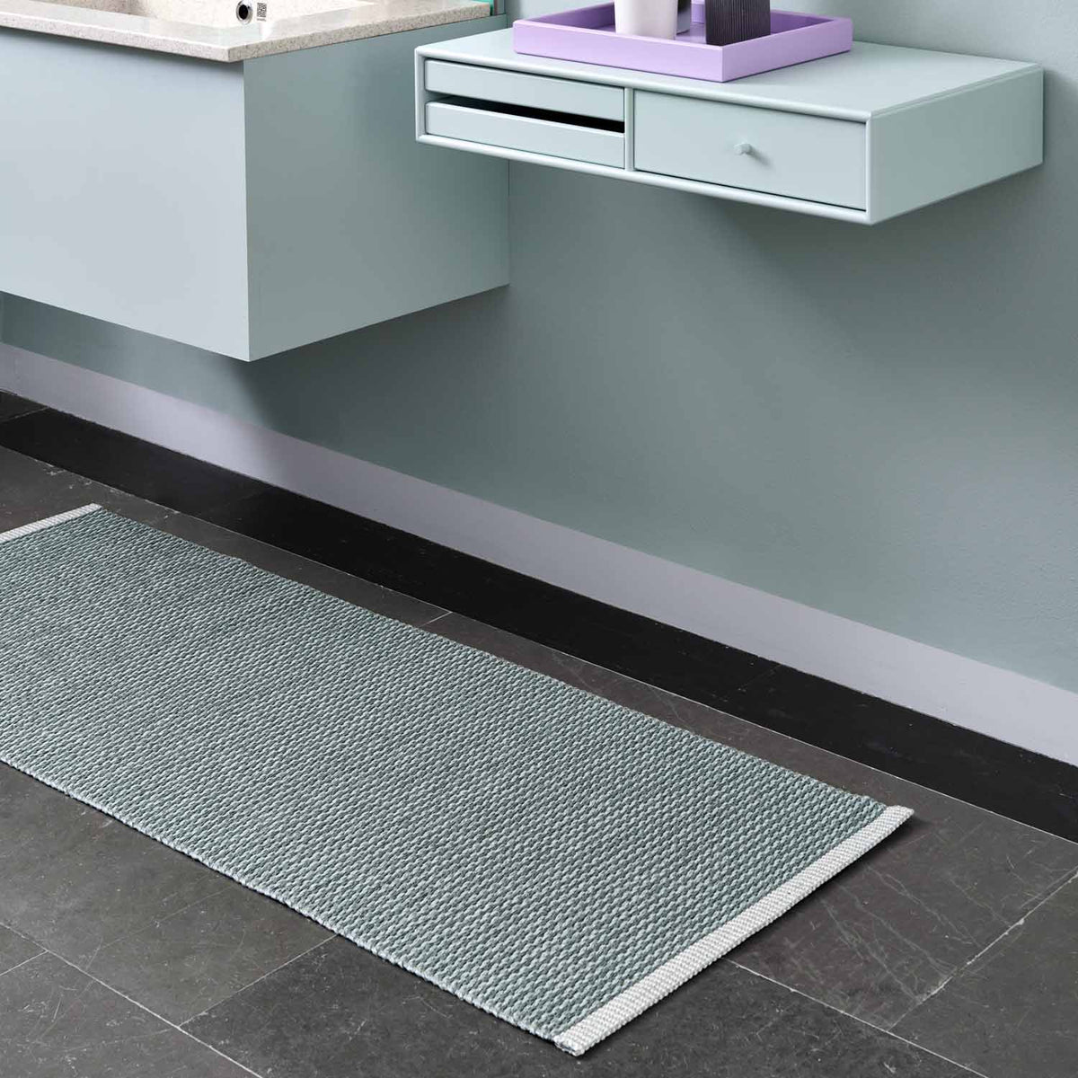 MONO Fossil Grey Rug by Pappelina, showing mono fossil grey rug in live shot.