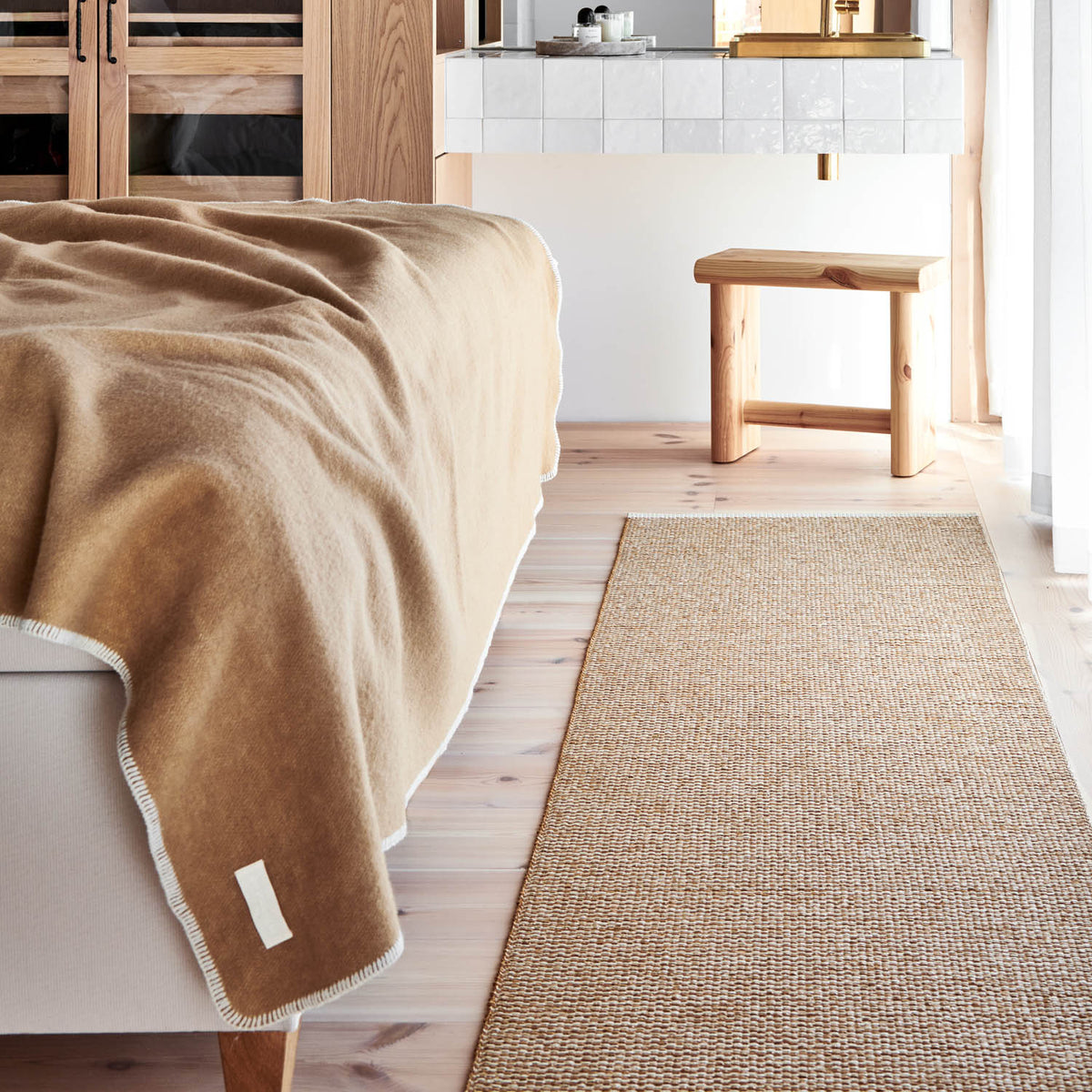 MONO Ochre Rug by Pappelina, showing mono ochre rug in live shot.