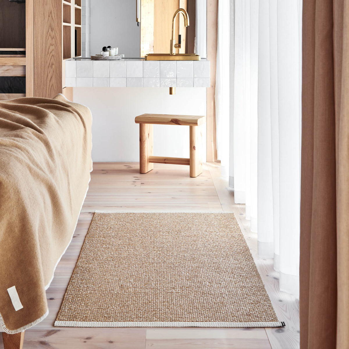 MONO Ochre Rug by Pappelina, showing mono ochre rug in live shot.