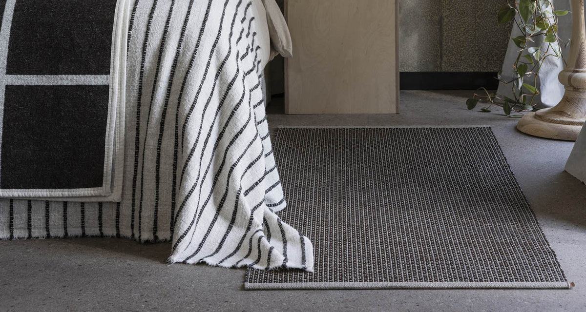 NILS Dark Brown Runner Rug by Pappelina, showing nils dark brown runner rug in live shot.
