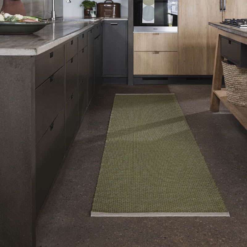 NILS Dark Olive Runner Rug by Pappelina, showing nils dark olive runner rug in live shot.