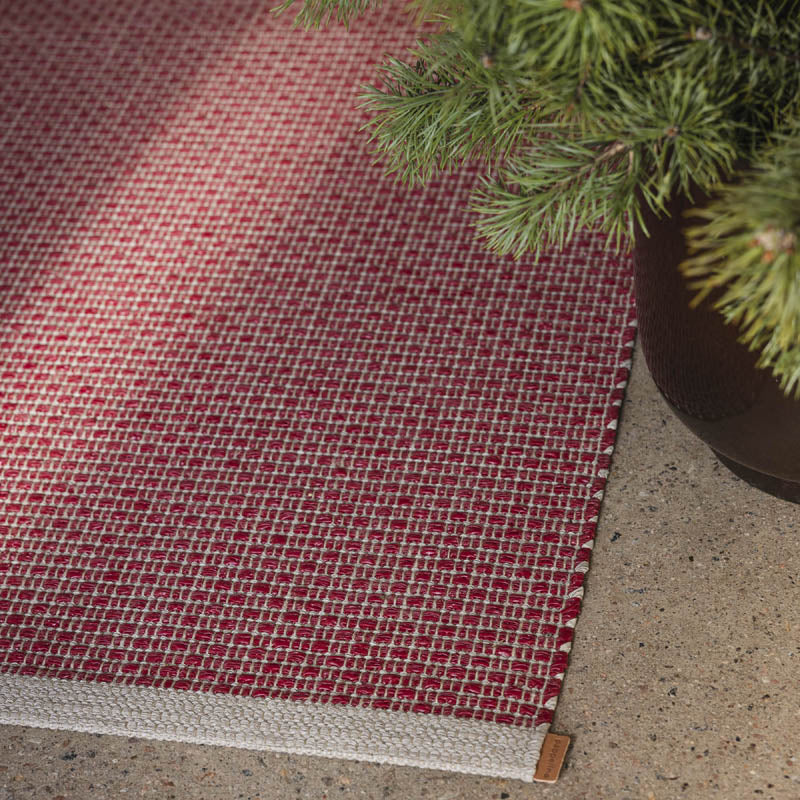 NILS Dark Red Runner Rug by Pappelina, showing nils dark red runner rug in live shot.