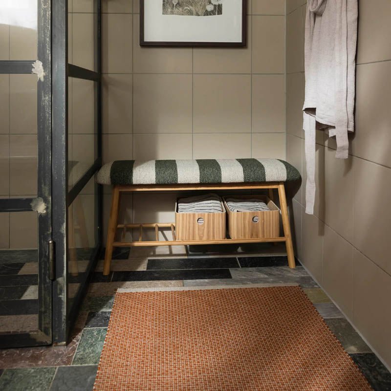 NILS Rust Runner Rug by Pappelina, showing nils rust runner rug in live shot.