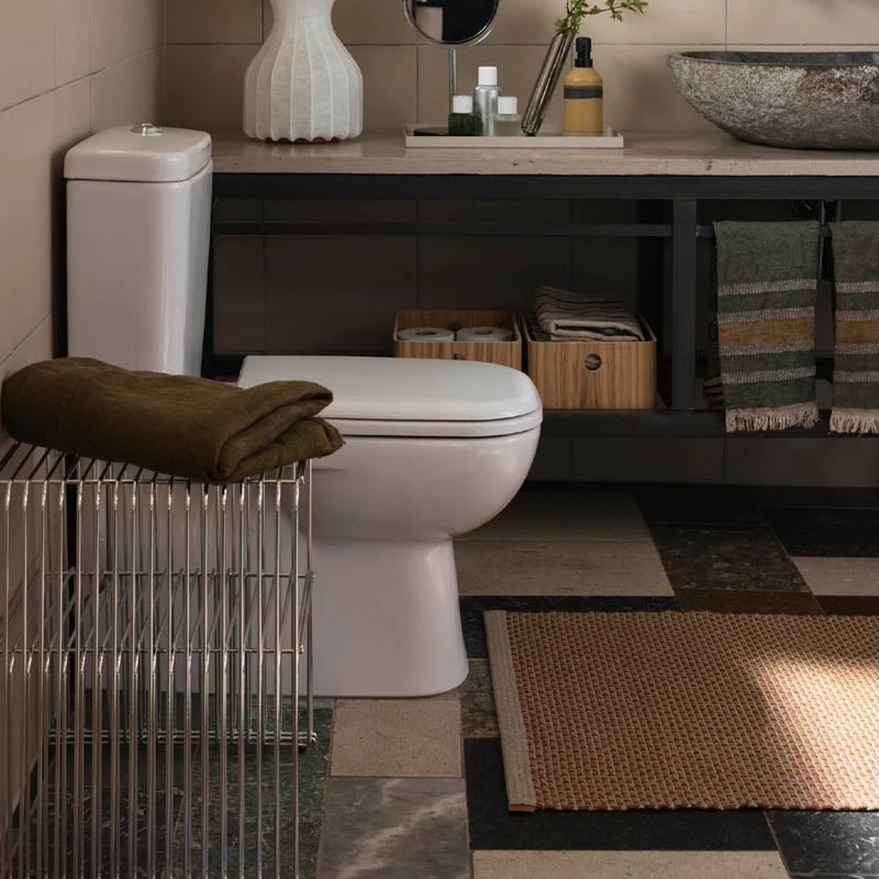 NILS Rust Runner Rug by Pappelina, showing nils rust runner rug in live shot.