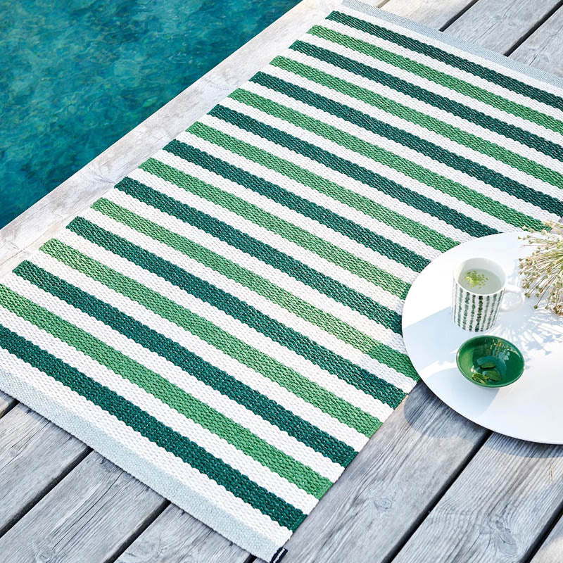 TEO Dark Green Runner Rug by Pappelina, showing teo dark green runner rug in live shot.