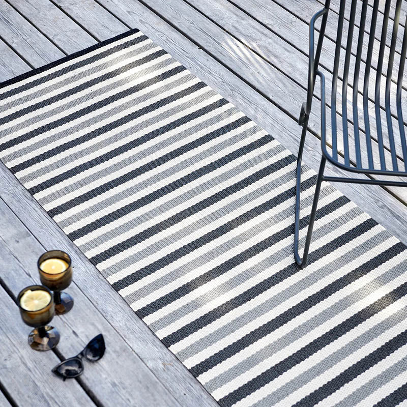 TEO Warm Grey Runner Rug by Pappelina, showing teo warm grey runner rug in live shot.