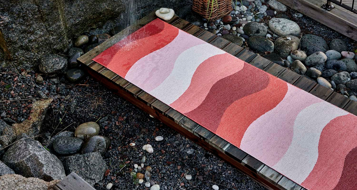 Urvi Fire Runner Rug by Pappelina, showing urvi fire runner rug in live shot.