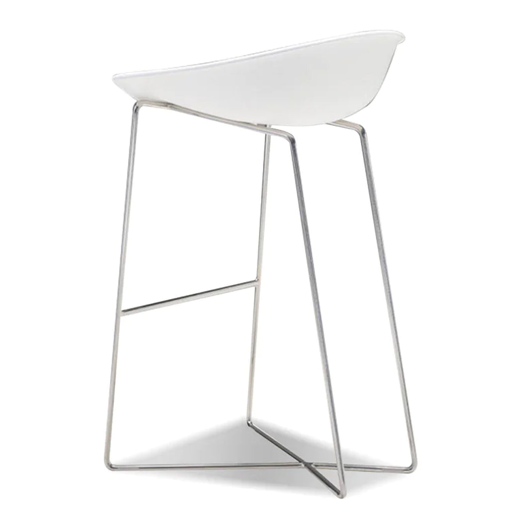 Paraiso Bar Stool by Mobital, showing side view of paraiso bar stool in matte white solid surface/polished stainless steel legs.