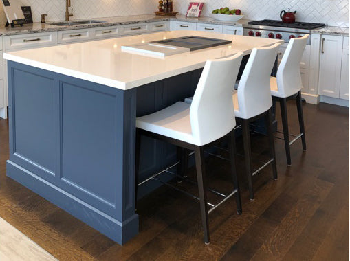 Pasha Wood Counter Stool by SohoConcept, showing wood stools with table in live shot.
