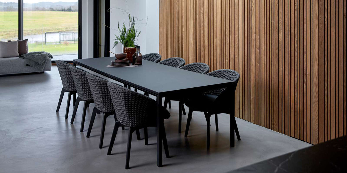 Peacock Indoor Dining Chair by Cane-Line, showing peacock indoor dining chairs in live shot.