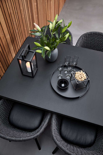 Peacock Indoor Dining Chair by Cane-Line, showing closeup view of peacock indoor dining chairs in live shot.